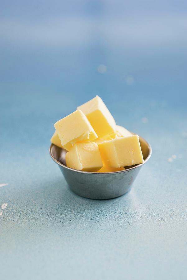 Butter Cubes In A Metal Bowl Photograph by Great Stock!