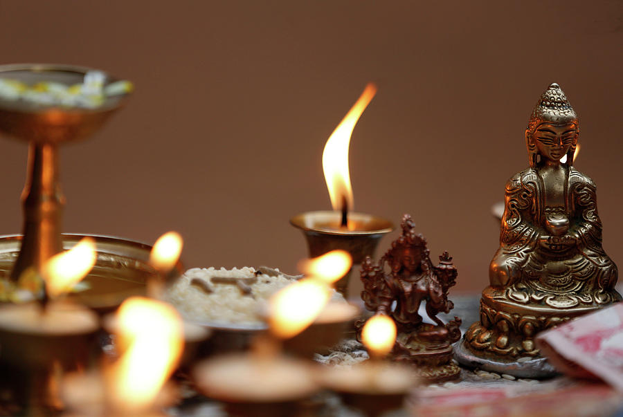 Butter Lamps Are Offered Near the Idol Photograph by Navesh Chitrakar ...