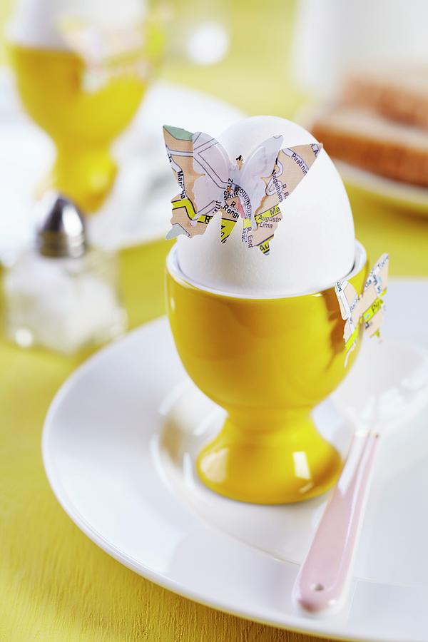 Butterfly Shapes Punched From Old Maps Decorating Boiled Egg On Breakfast Table Photograph by Franziska Taube