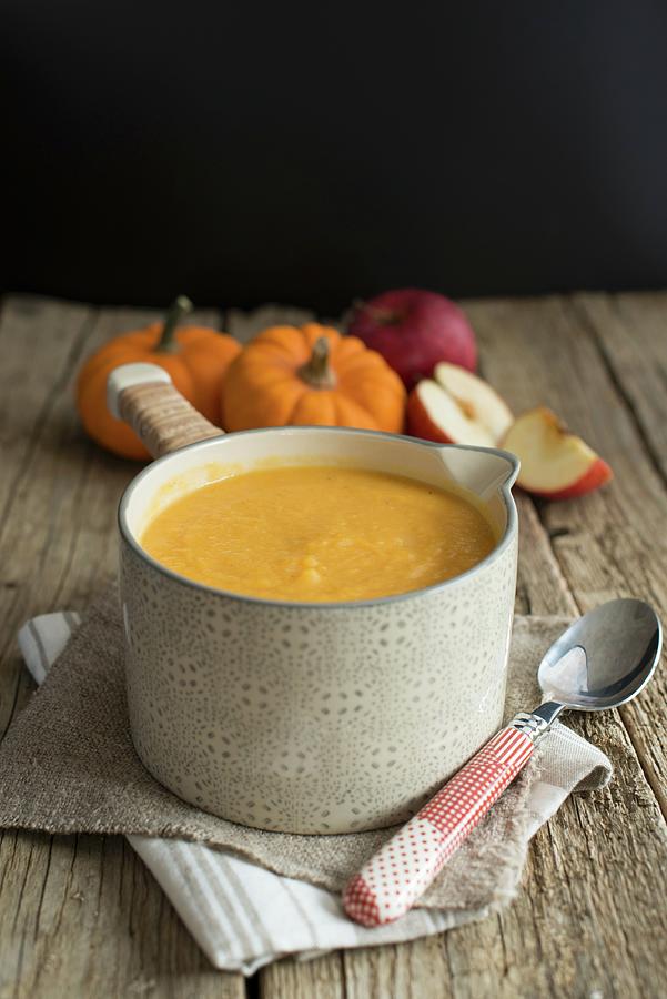 Butternut Squash And Apple Soup In A Saucepan Photograph by Sonia Chatelain