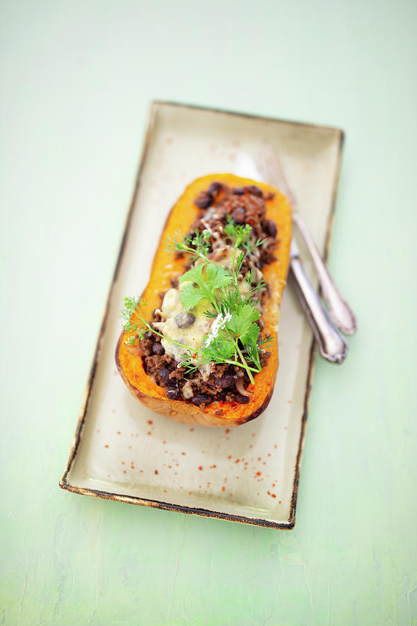 Butternut Squash Filled With Minced Meat And Black Beans On A Tray Photograph by Jan Wischnewski