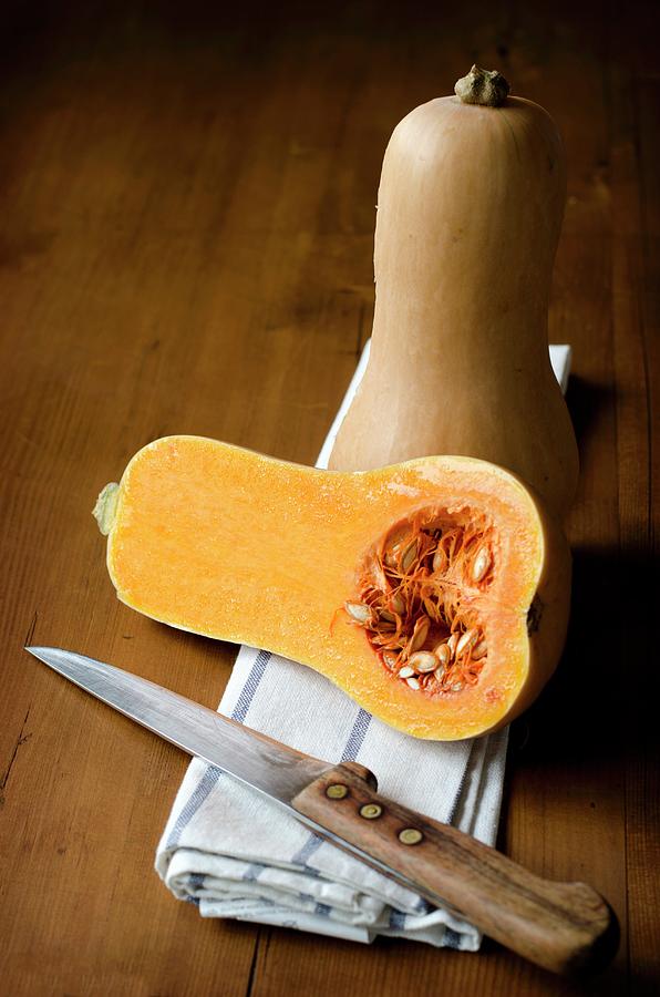 Butternut Squash, Whole And Halved Photograph by Jamie Watson