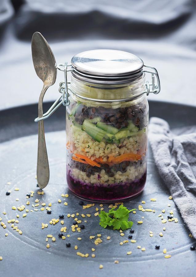 Cabbage Salad With Carrots, Cucumber, Bulgur Wheat And Beluga Lentils In A Glass Jar vegan Photograph by Kati Neudert