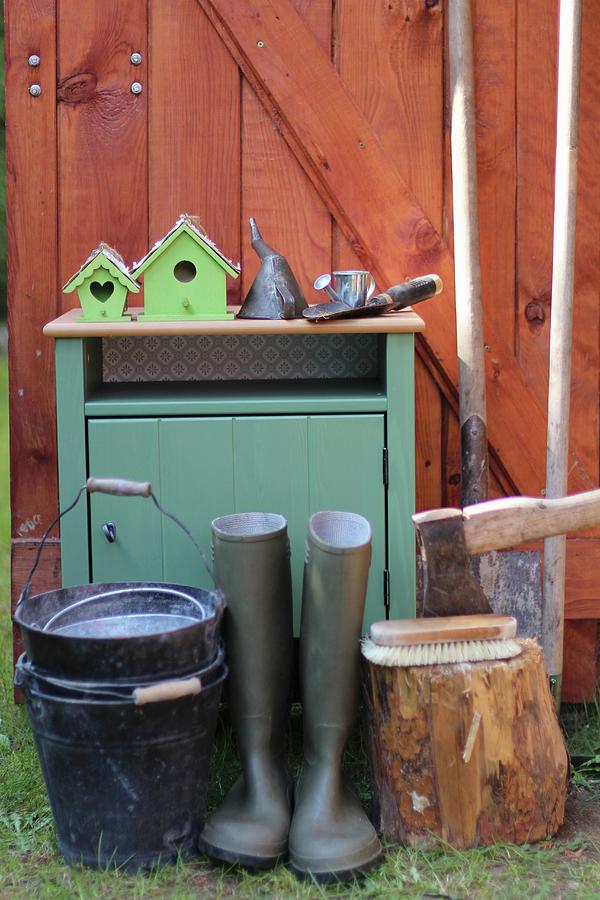 Cabinet And Various Gardening Utensils Outside Wooden Shed Photograph by Sylvia E.k Photography