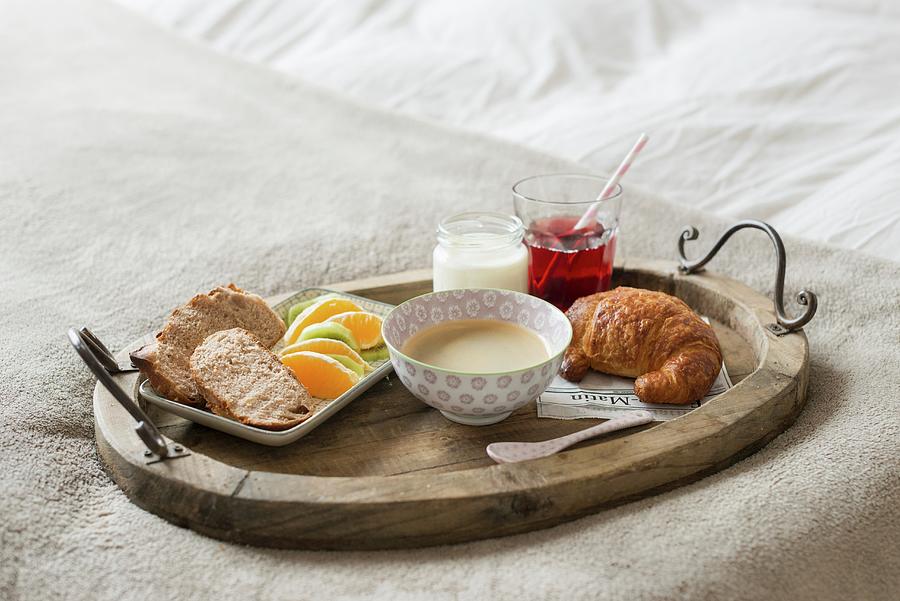 Caf Au Lait, A Croissant And Fresh Fruit On A Breakfast Tray On A White Bed Photograph by Sonia Chatelain