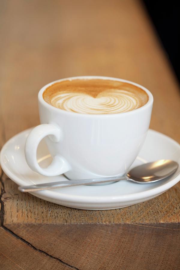 Coffee Photograph - Cafe Latte In White Mug by Lauren Mclean
