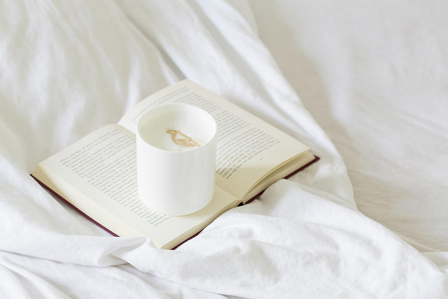 Cafe Latte On A Book On A Bed Photograph by Jennifer Braun