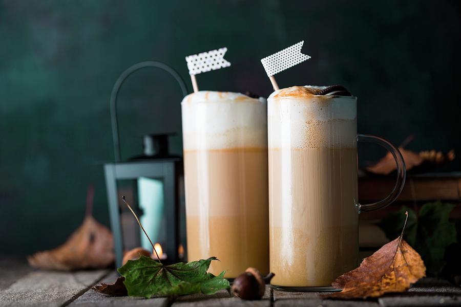 Coffee Photograph - Caffe Lattes With Pumpkin Puree, Caramel And Cream by Valeria Aksakova