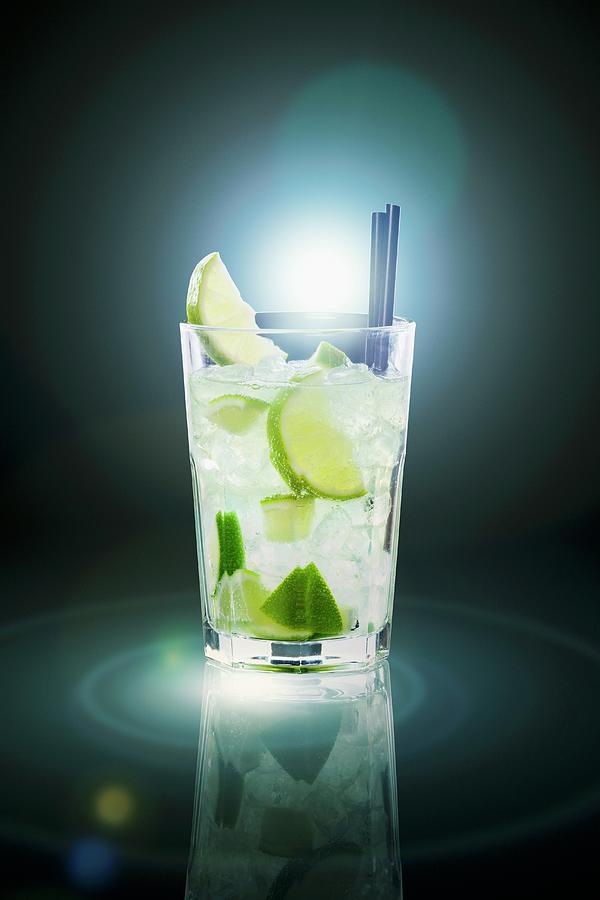 Caipirinha With Ice Cubs And Limes Photograph by Krger & Gross