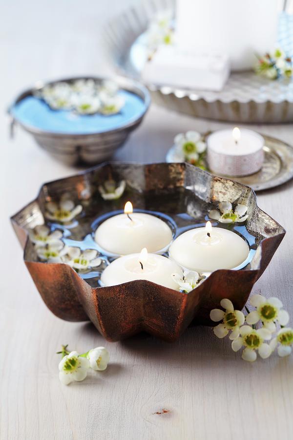 Cake Mould Used As Bowl For Floating Candles & Waxflowers Photograph by Franziska Taube