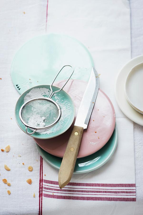 Cake Plates And A Sieve With Icing Sugar In A Bowl Photograph by Manuela Rther