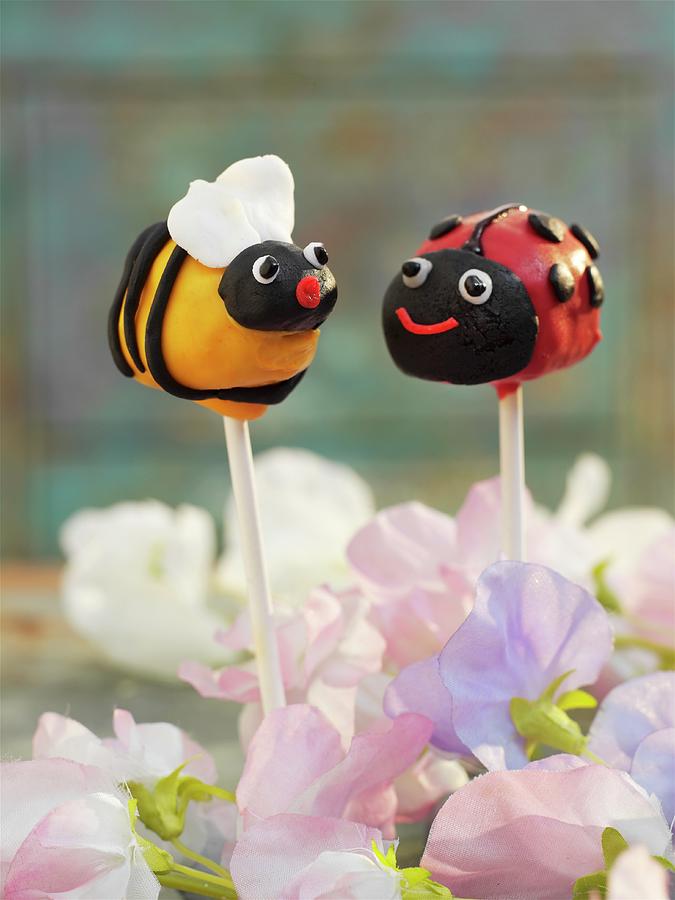 Cake Pops Decorated To Look Like A Bee And A Ladybird Photograph by Garlick, Ian