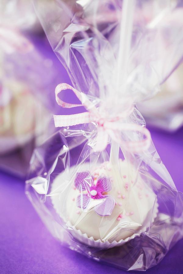 Cake Pops On A Purple Surface, Wrapped As A Gift Photograph by Barbara Pheby