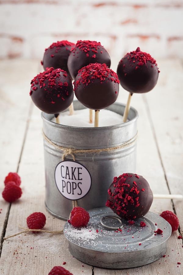 Cake Pops With Raspberries In A Metal Tin Photograph by Eising Studio - Food Photo & Video