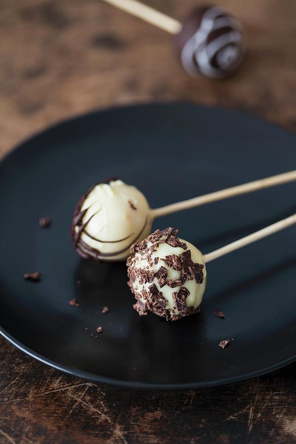 Cake Pops With White And Dark Chocolate On A Plate Photograph by Malgorzata Laniak