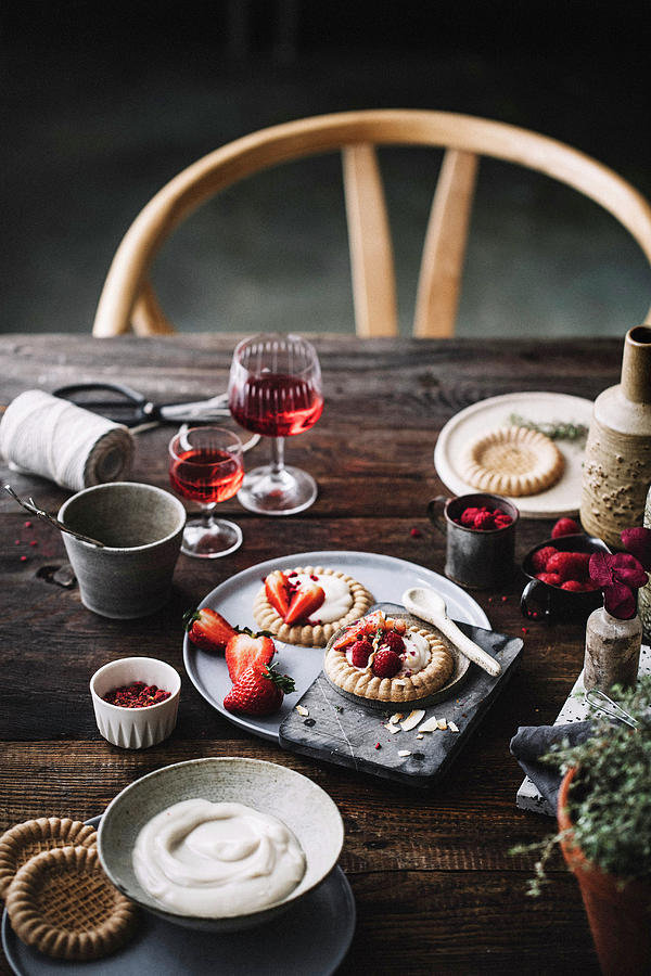 Cake Tartlets With Vanilla Pudding And Strawberries On A Rustic Table Photograph by Claudia Gdke
