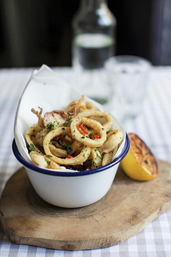 Calamari With Grilled Lemon Photograph by Helen Cathcart