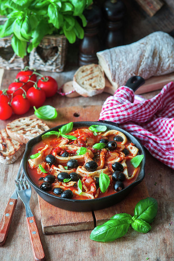 Calamari With Tomatoes And Olives Photograph by Irina Meliukh