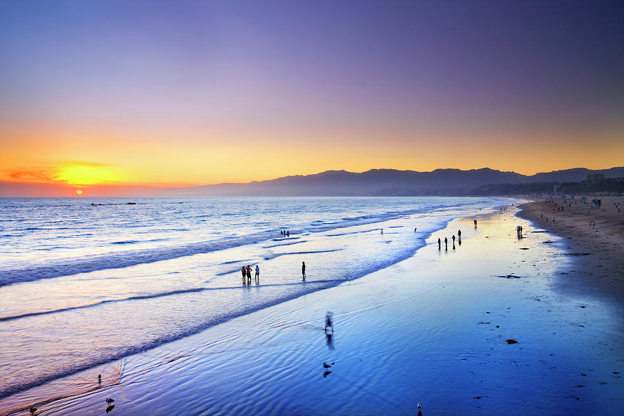 California, Los Angeles, Pacific Ocean, Santa Monica, People Walking Along Santa Monica Beach At Sunset With The Santa Monica Mountains In Background Digital Art by Pietro Canali