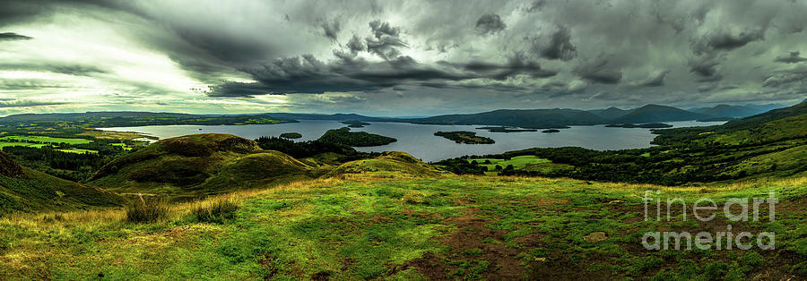 Calm Water And Green Meadows At Loch Lomond In Scotland Photograph by Andreas Berthold