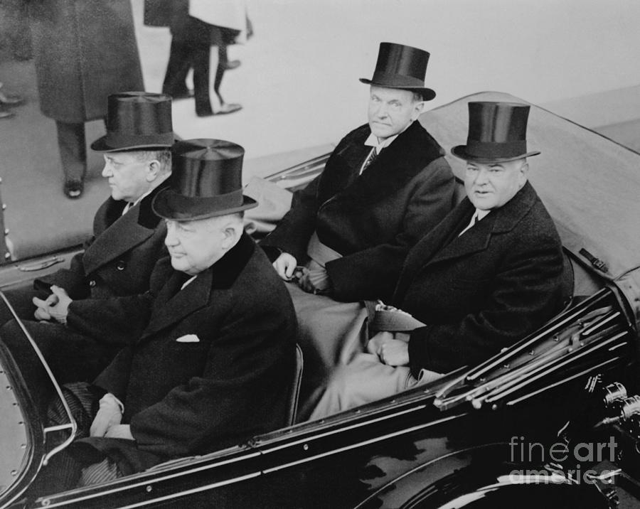 calvin-coolidge-riding-in-a-car-photograph-by-bettmann