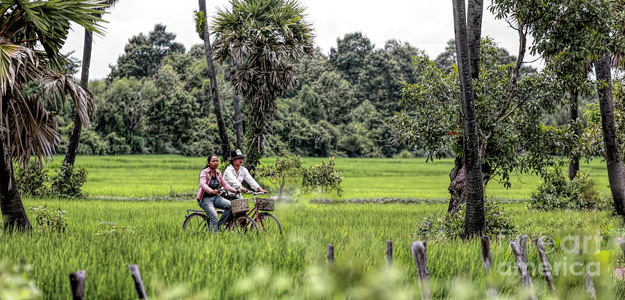 Cambodian Couple Motorcycle Fields of Cambodia  Photograph by Chuck Kuhn