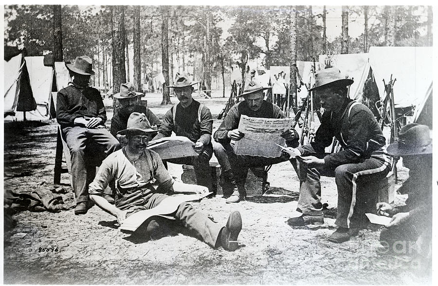 Camp Scene Where Solidiers Read Newspape Photograph by Bettmann
