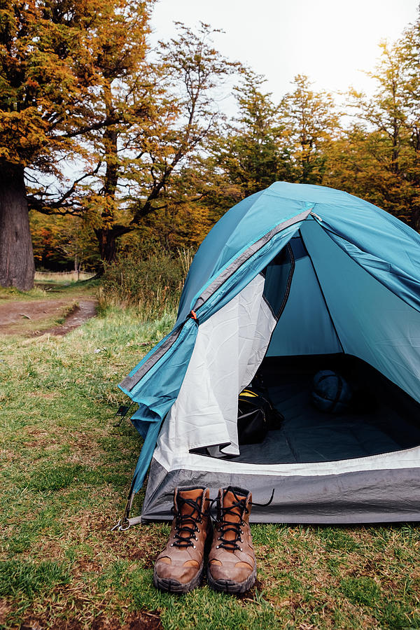 Camping Tent And Trekking Boots In Autumn Forest Photograph by Cavan ...