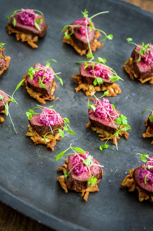 Canapes: Crispy Potato Hash, Venison And Beetroot Salad Garnished With Parsley Leaves On A Dark Metal Serving Plate Photograph by Giulia Verdinelli Photography