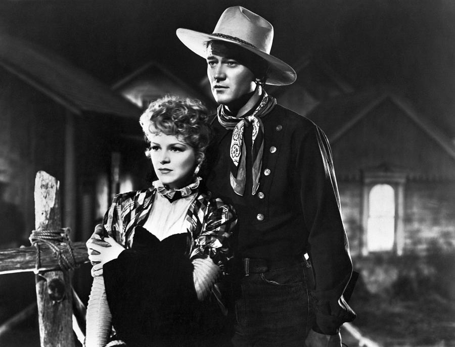 Candid Portrait Of Claire Trevor And John Wayne From 'stagecoach 