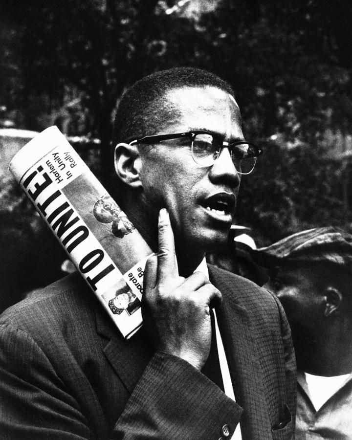 Candid Portrait Of Malcolm X Holding Newspaper Photograph by Globe ...