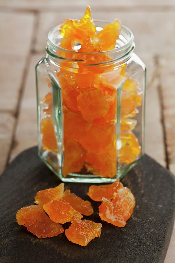 Candied Orange Pieces In A Screw-top Jar Photograph by Shawn Hempel
