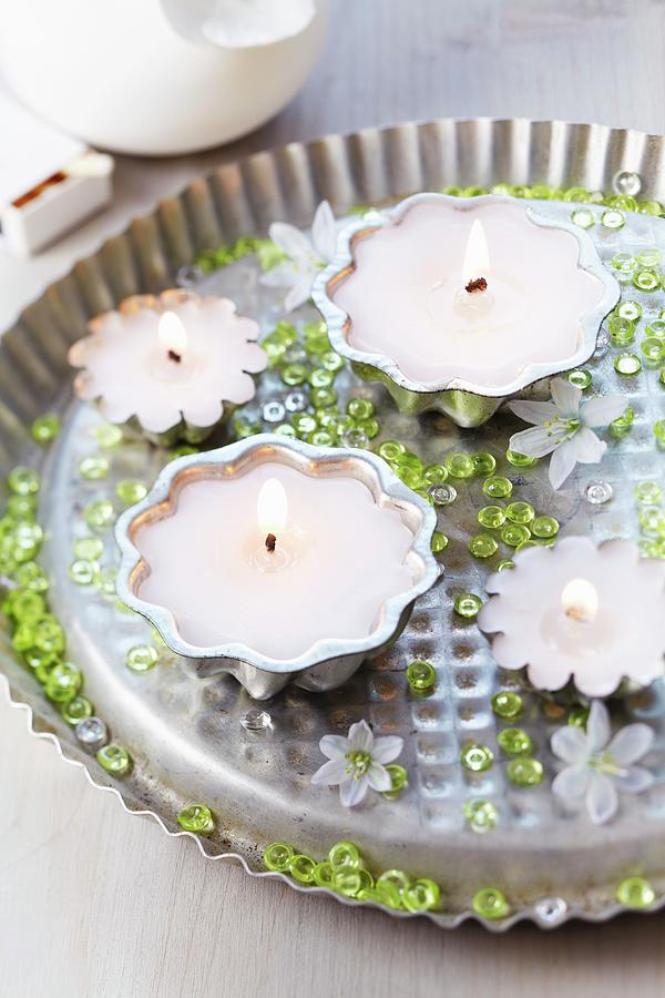 Candle Arrangement With Cake Moulds, Decorative Pebbles And Glory-of-the-snow Flowers Photograph by Franziska Taube