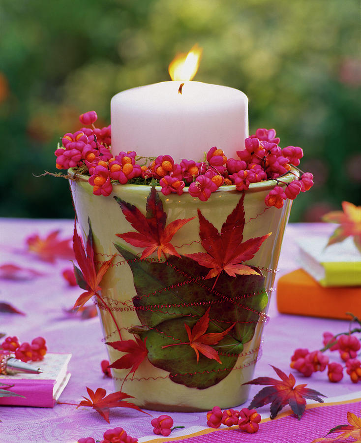 Candle Decoration With Euonymus And Autumn Leaves From Acer Photograph by Friedrich Strauss