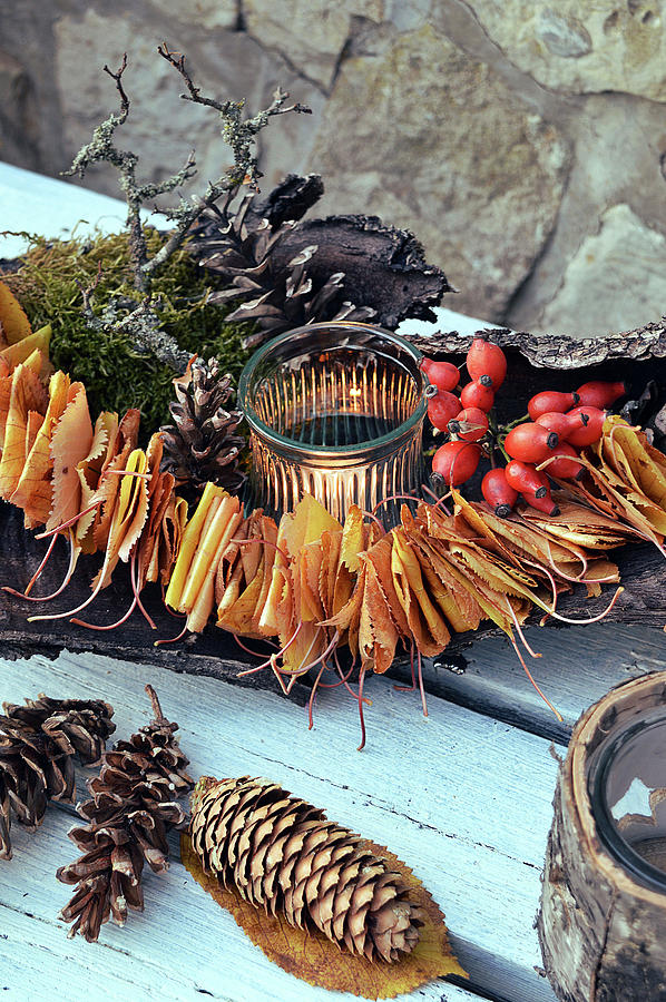 Candle Lantern Surrounded By Leaves, Bark, Pine Cones And Rose Hips Photograph by Christin By Hof 9