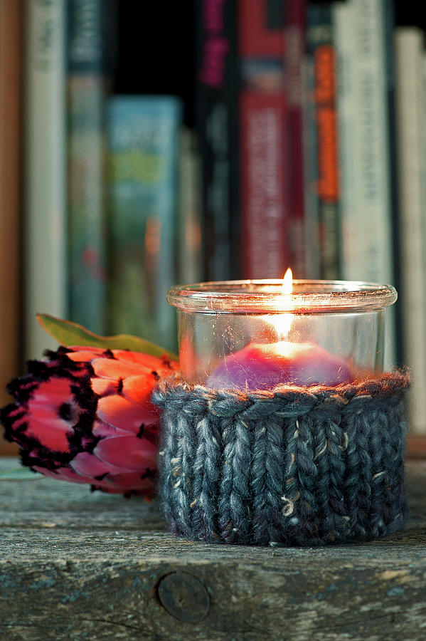 Candle Lantern With Knitted Cover And Protea Flower Lying On Surface Photograph by Elisabeth Berkau