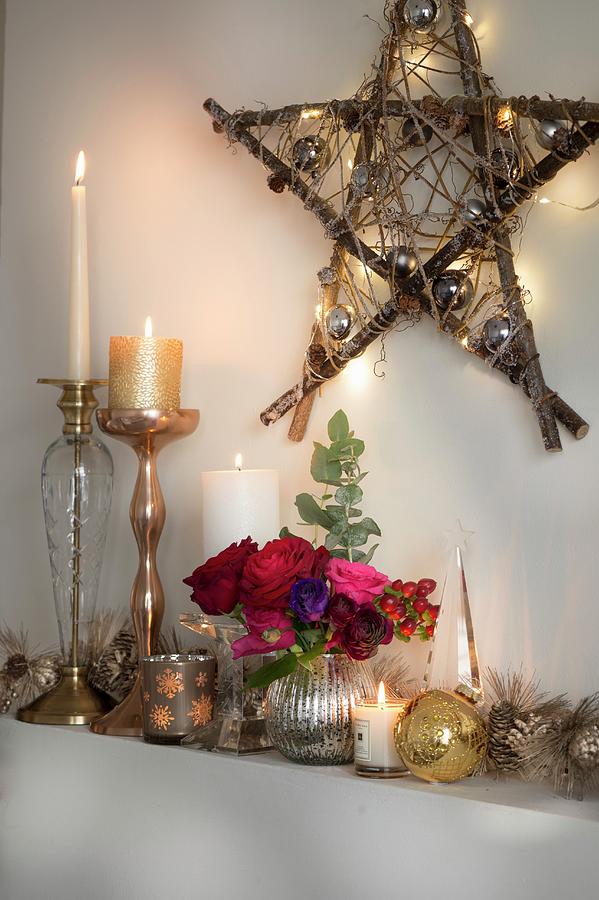 Candles And Shiny Ornaments Below Star Made From Branches And Decorated With Fairy Lights Photograph by Winfried Heinze