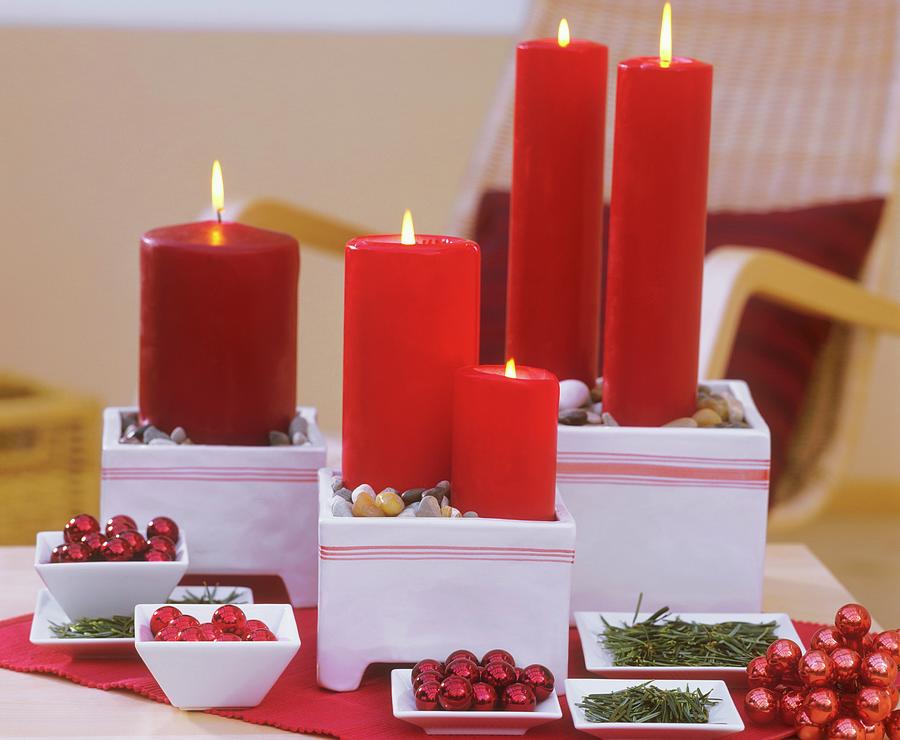 Candles In Ceramic Pots, Stones, Baubles And Fir Needles Photograph by Friedrich Strauss