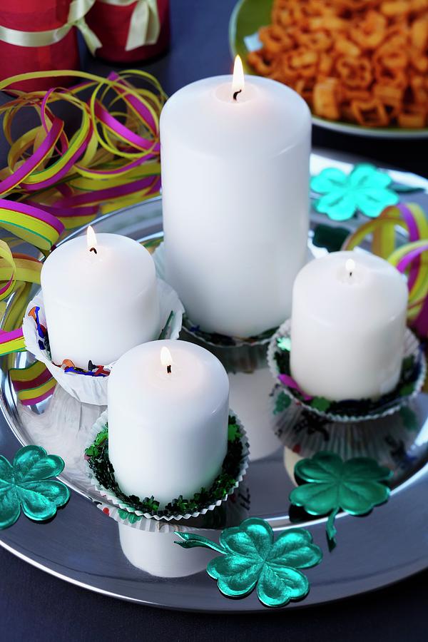 Candles In Paper Cake Cases On Silver Platter With Scattered Table Confetti Photograph by Franziska Taube