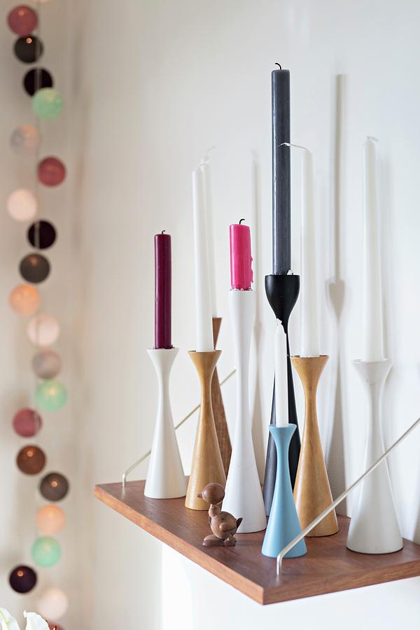Candles Of Various Colours In Scandinavian Candlesticks Photograph by Cecilia Mller