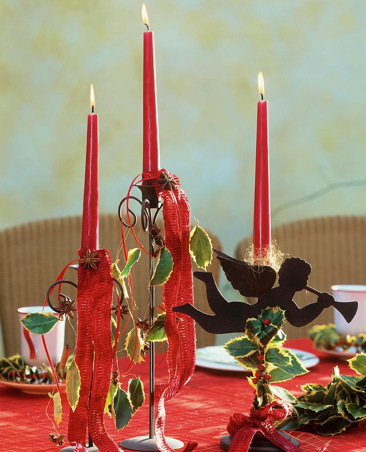 Candlestick Decorated With Holly Leaves And Berries Photograph by Friedrich Strauss