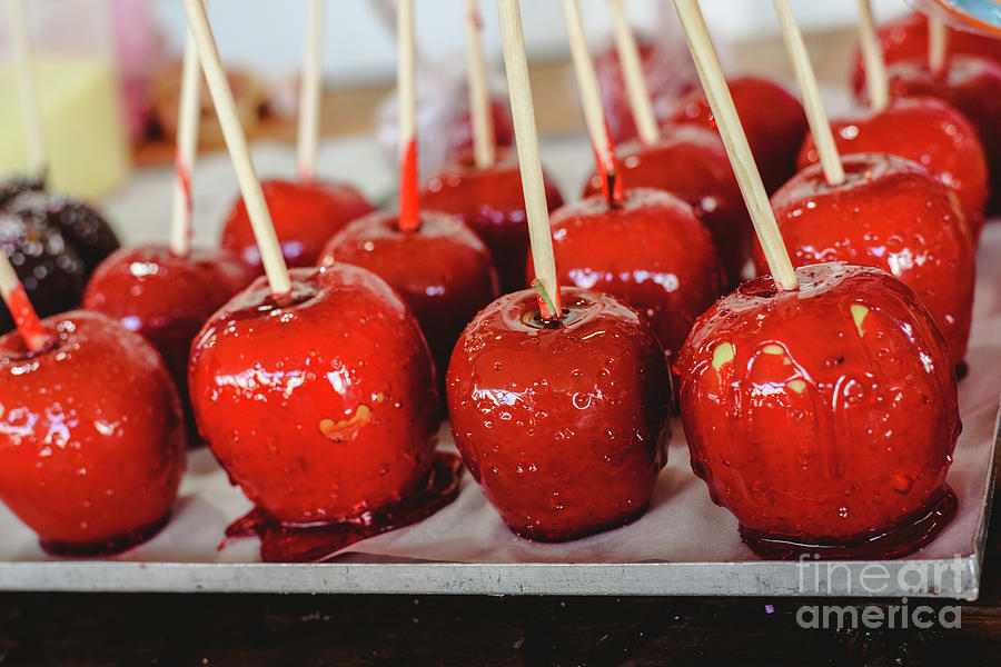 Candy Apple Coated With Red Caramel Candy For Sale For Kids. Photograph by Joaquin Corbalan