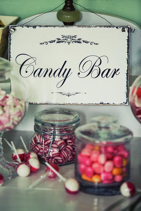 Candy Buffet Bar With Vintage Enamel Sign Photograph by Jan Wischnewski