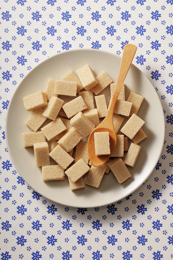 Cane Sugar Cubes On A White Plate Photograph by Jean-christophe Riou