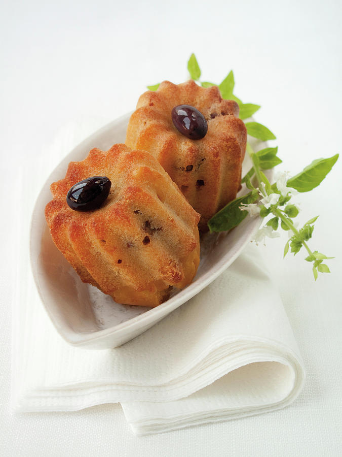 Caneles With Olives, Parmesan Cheese And Dried Tomatoes Photograph by Hilde Mche