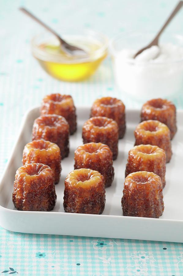 Canneles With Honey Photograph by Jean-christophe Riou