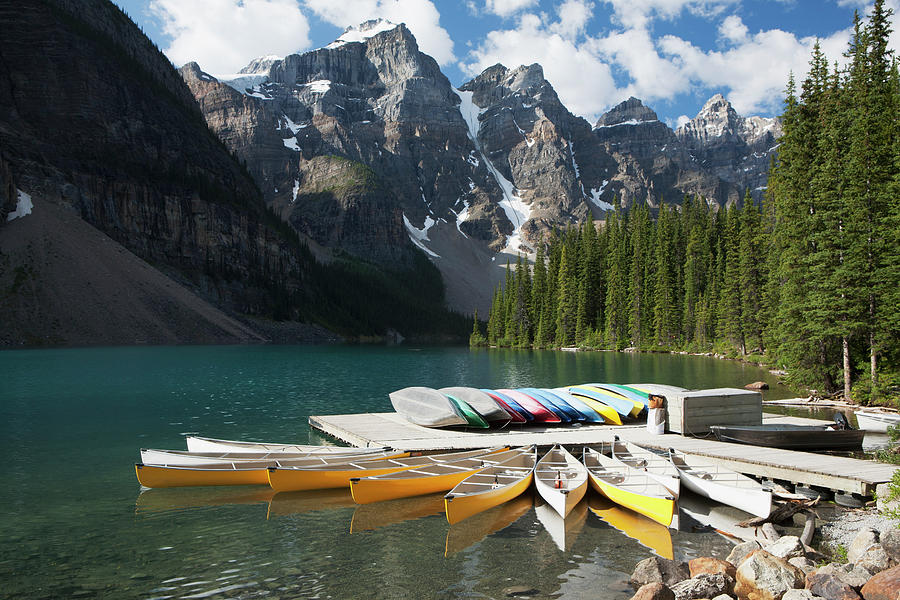 Canoes Around A Dock On A Lake With Photograph by Michael Interisano / Design Pics