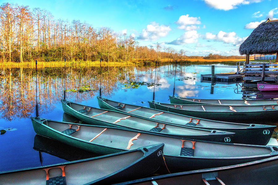 Canoes at Sunset Photograph by Debra and Dave Vanderlaan