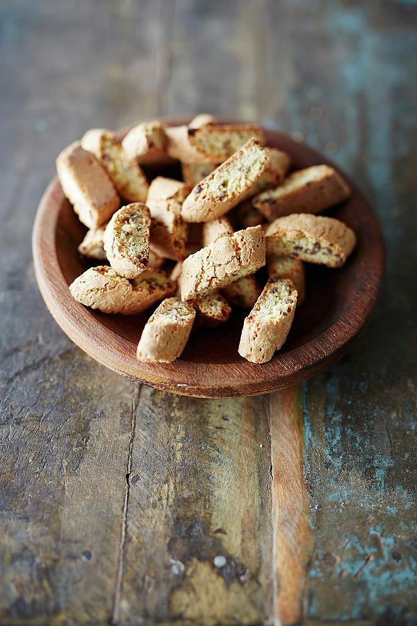 Cantuccini In A Wooden Bowl Photograph by Rafael Pranschke