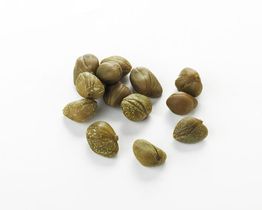Caper Rs Buds On A White Background Photograph by Ulrike Koeb